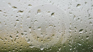 Rain droplets hitting a window during a rainstorm. UK