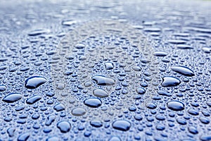 Rain drops on a blue car body with Hydrophobic Effect