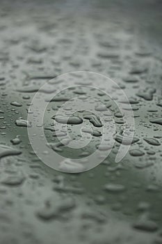 Rain drops on car with glass coating protection