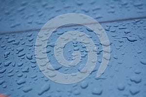 Rain drops on the car surface, Driving in rain,texture background.