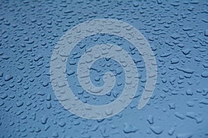 Rain drops on the car surface.