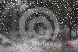 Rain drops on car windshield on rainy days.