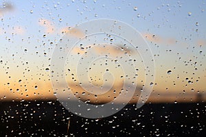 Rain drops and defocused sky background.
