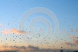 Rain drops and defocused sky background.