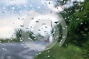 Rain drops on glass windscreen window close-up