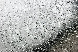 Rain drops on gray glass