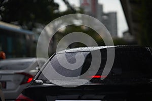 Rain drops on rear car mirror shield