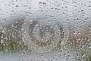 Rain drops on window glass, closeup