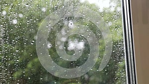 Rain drops on the window glass. Rainy day.