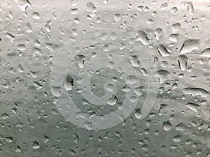 Rain drops on a window pane as a background