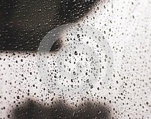 Rain drops on window. Rainy day. Bad weather background. Raindrops in glass surface. Water drops on car window. Water condensation