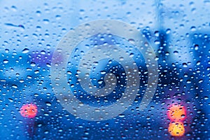 Rain drops on window on road