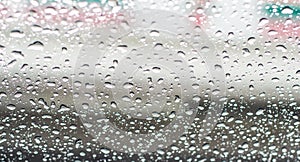 Rain drops on the window screen with blurred backgrounds