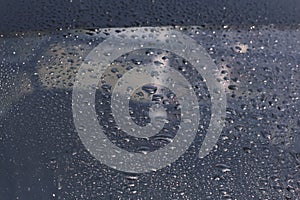 Rain drops on window weather water on the background.