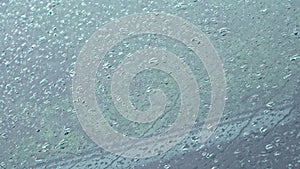 Rain drops on the windshield of the car