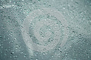 Rain falling on glass (rain-drops)