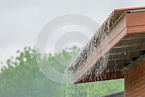 Rain flowing down from the roof house