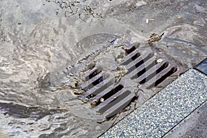 Rain flowing into a storm water sewer system
