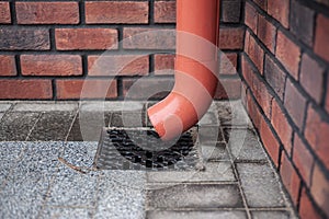 Rain flowing into a storm water sewer system.