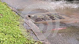 Rain flowing into a storm water sewer system. Storm sewer after a heavy rain