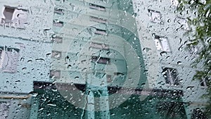 Rain flows down the windshield