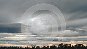 Rain and gray clouds. Puffy fluffy dark clouds. Cumulus cloud sky cloudscape time lapse. Autumn time lapse. Nature