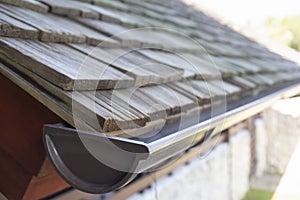 Rain gutter system for the roof of the house
