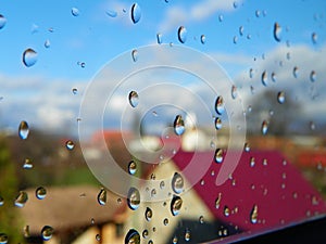 Water drops after rain on window glass.