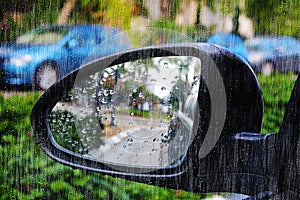 Rain in Israel floods the side mirror of the car. Winter rain in Israel, there is a flood threat and danger flooding