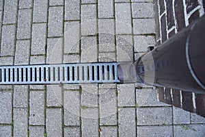 Rain pipe and landscape pavement drainage storm water system with galvanized grid metal tray