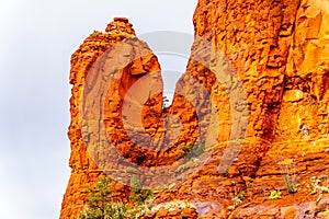 Rain pouring down on the geological formations of the red sandstone buttes surrounding the Chapel of the Holy Cross at Sedona