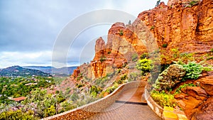 Rain pouring down on the geological formations of the red sandstone buttes surrounding the Chapel of the Holy Cross at Sedona