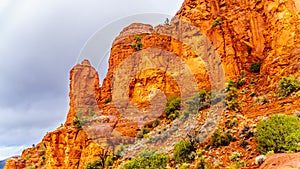 Rain pouring down on the geological formations of the red sandstone buttes surrounding the Chapel of the Holy Cross at Sedona