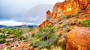 Rain pouring down on the geological formations of the red sandstone buttes surrounding the Chapel of the Holy Cross at Sedona