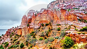 Rain pouring down on the geological formations of the red sandstone buttes surrounding the Chapel of the Holy Cross at Sedona