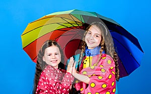 Rain protection. Rainbow. autumn fashion. happy little girls with colorful umbrella. cheerful hipster children