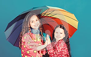 Rain protection. Rainbow. autumn fashion. happy little girls with colorful umbrella. cheerful hipster children