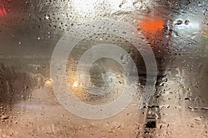 Rain on the road from car window, dangerous vehicle driving in rainy. Abstract blurred bad weather car, background