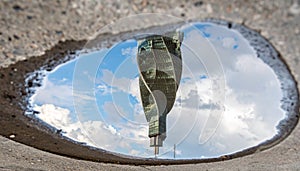 Urban Tower Reflected in a Puddle