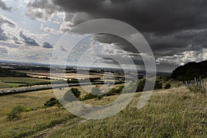 Rain storm over landscape highway in distamce