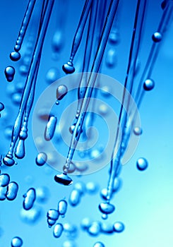 Rain water drop on blue background