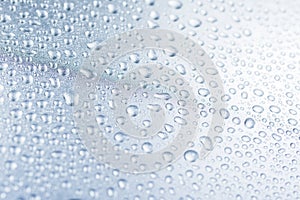 Rain water drops on blue