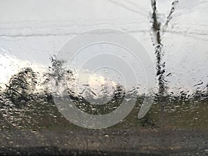 Rain water drops texture on a car glass surface. Rain water drops on car