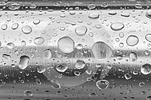 Rain water drops on a stainless steel surface