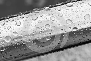 Rain water drops on a stainless steel surface