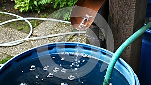 Rain Water Is Streaming into Barrel