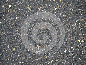 Rain wet surface of tarred road pavement