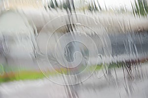 The rain on the window with blurred background.