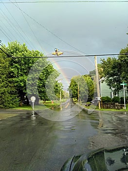 Rainbow at 4-way stop sign