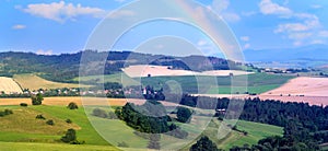 Rainbow above the Liptov panorama with Low Tatras Nizke Tatry and Liptovkska Mara water lake reservoir in the background.